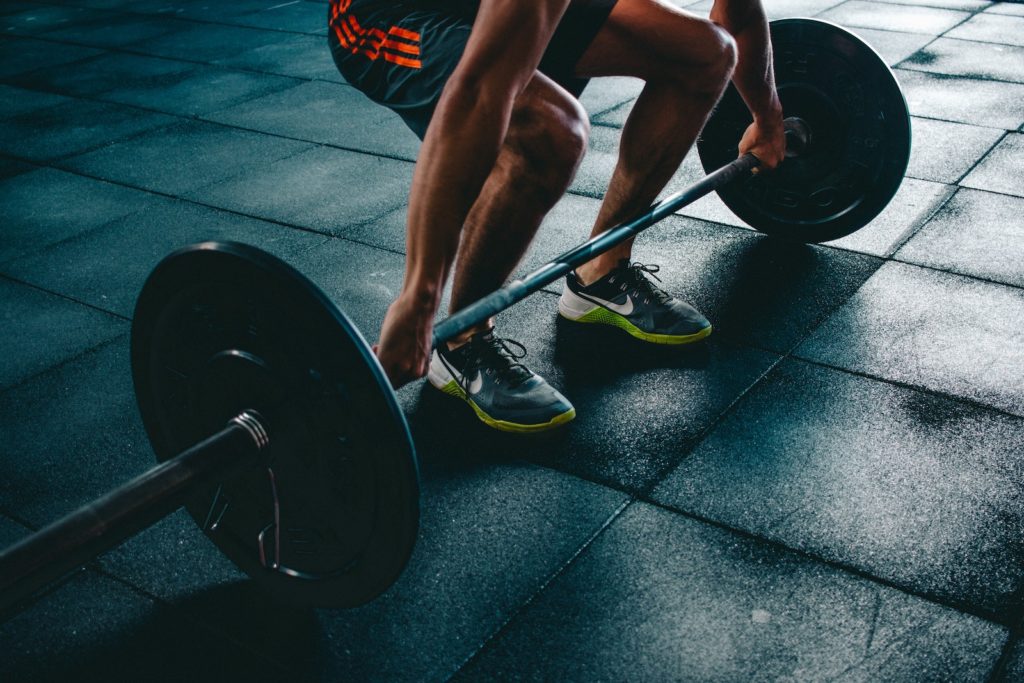 Gym member lifting weights